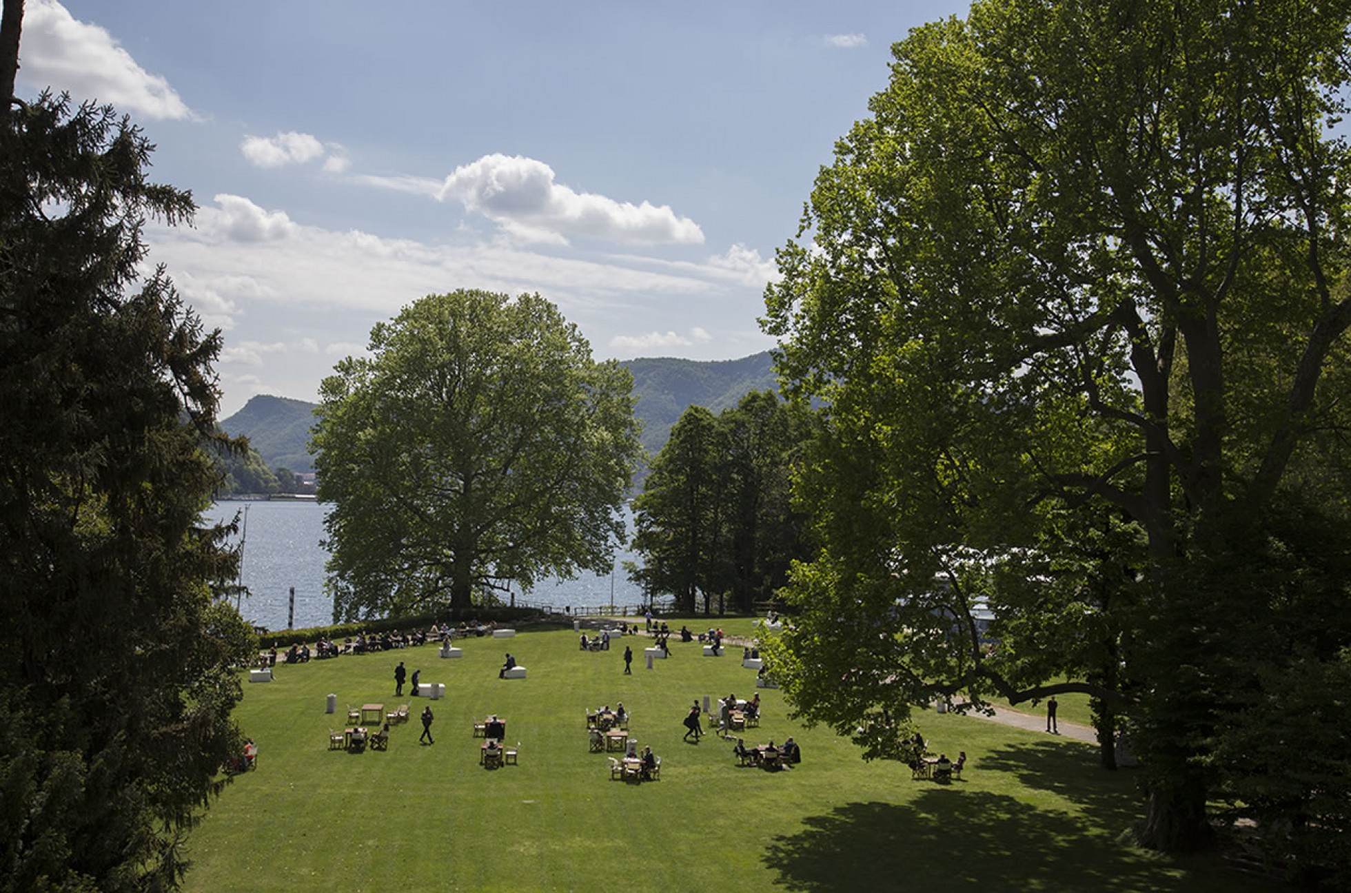 The botanical park running down toward Lake Como. The park hosts ceremonies and cocktails, and the estate has its own private pier for guest transfers.